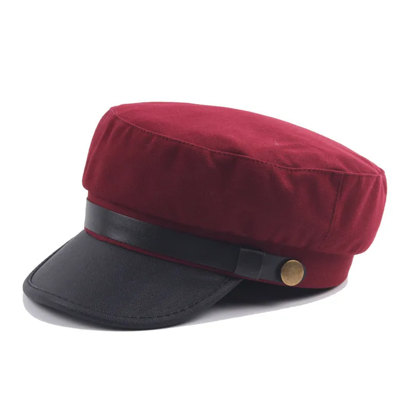 Navy imitation leather flat brim peaked cap with dome crown on white background