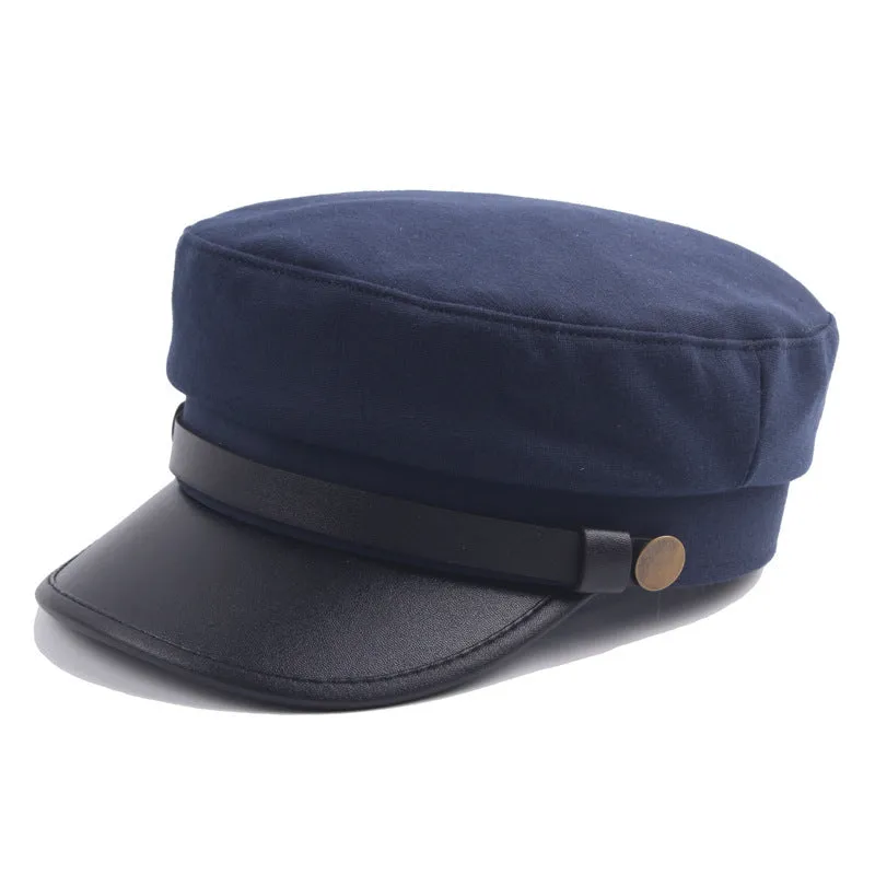 Navy imitation leather flat brim peaked cap with dome crown on white background