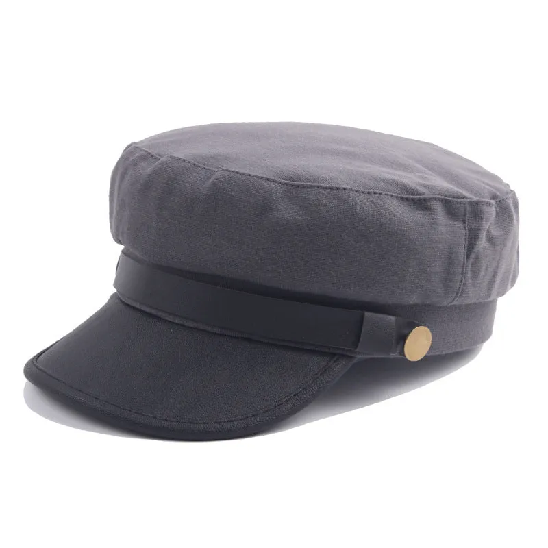 Navy imitation leather flat brim peaked cap with dome crown on white background