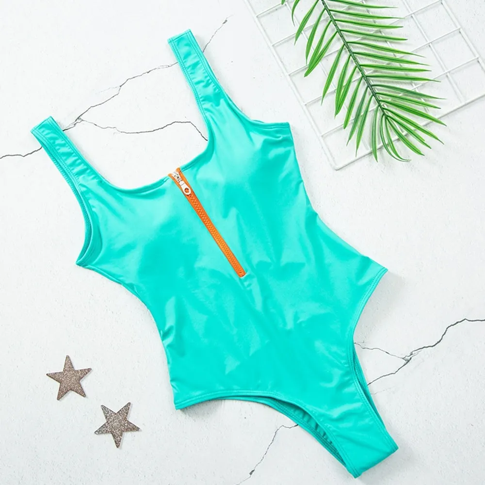 Ladies one-piece zipper printed nylon swimsuit in white with full front zip, side view on model