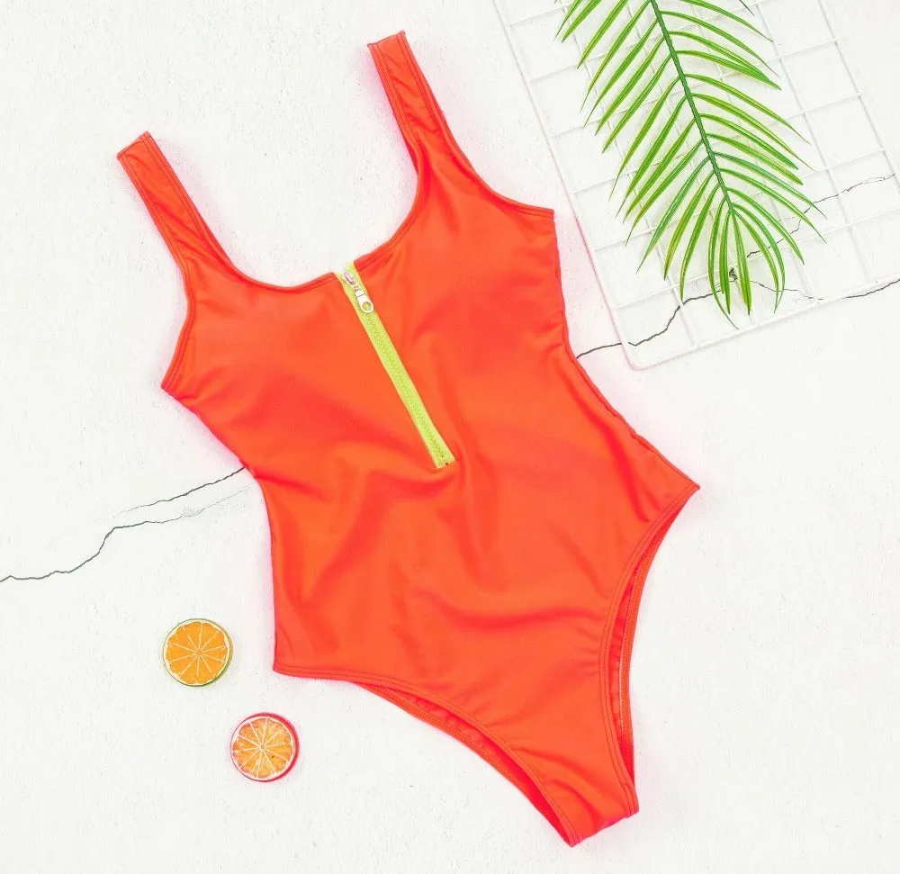 Ladies one-piece zipper printed nylon swimsuit in white with full front zip, side view on model
