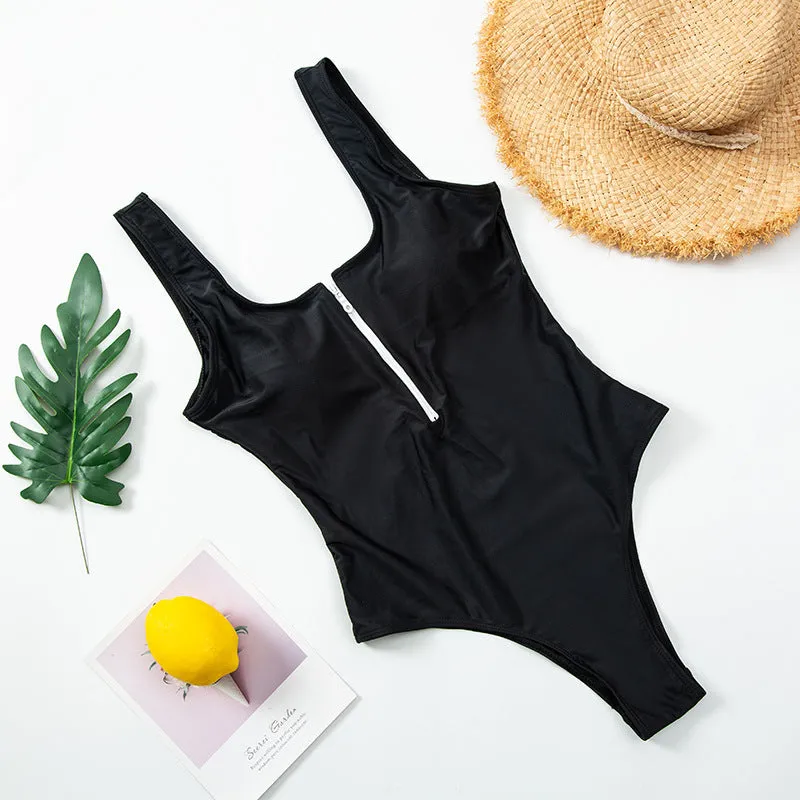 Ladies one-piece zipper printed nylon swimsuit in white with full front zip, side view on model