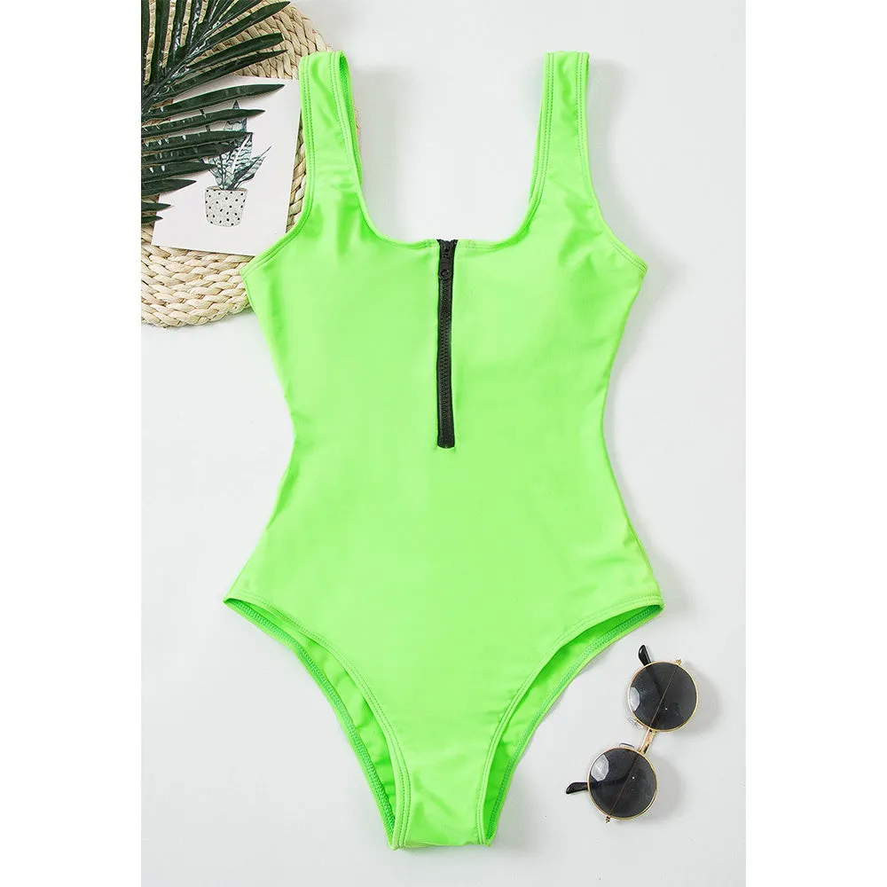 Ladies one-piece zipper printed nylon swimsuit in white with full front zip, side view on model