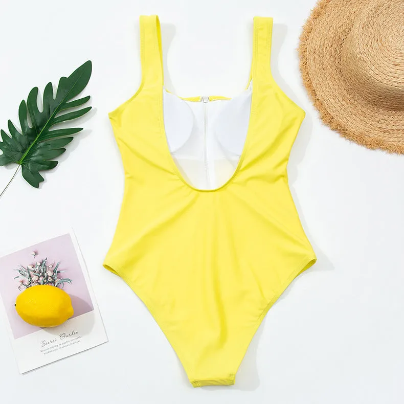 Ladies one-piece zipper printed nylon swimsuit in white with full front zip, side view on model
