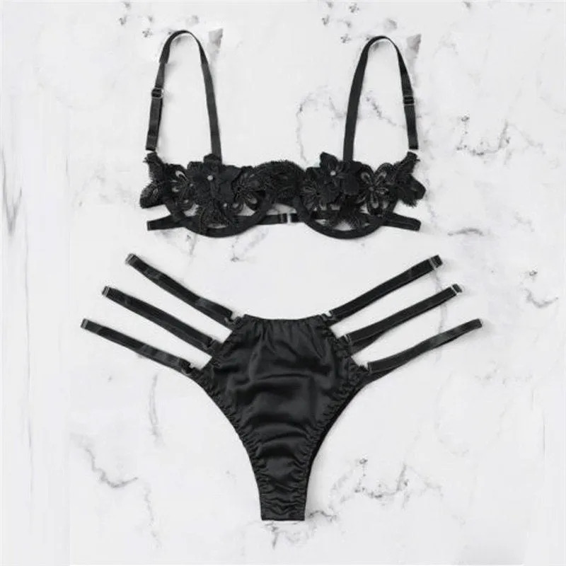 Women's black half cup unlined lingerie set with floral pattern and fitted straps