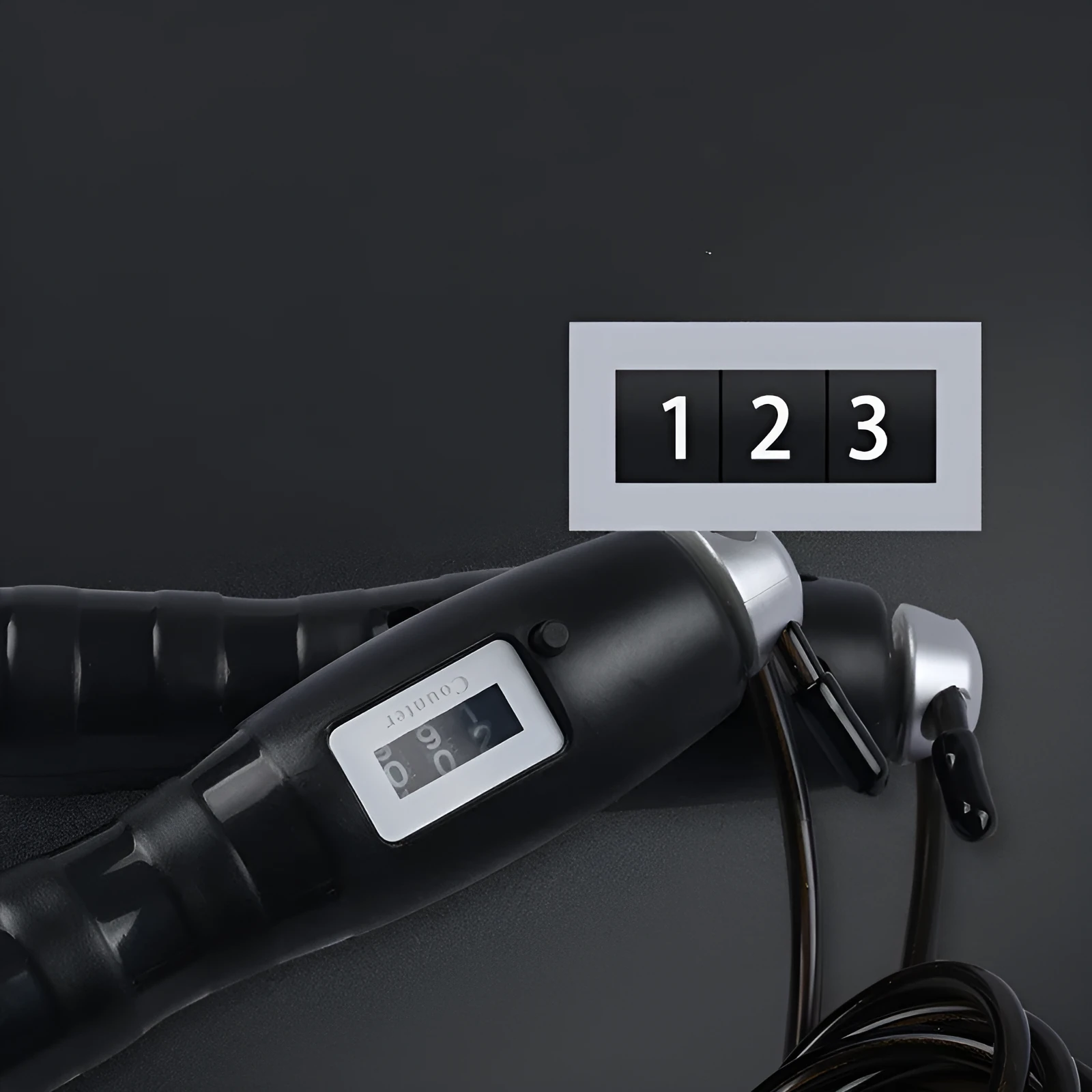 Adjustable digital skipping rope with black ABS handle and coated steel cable on white background