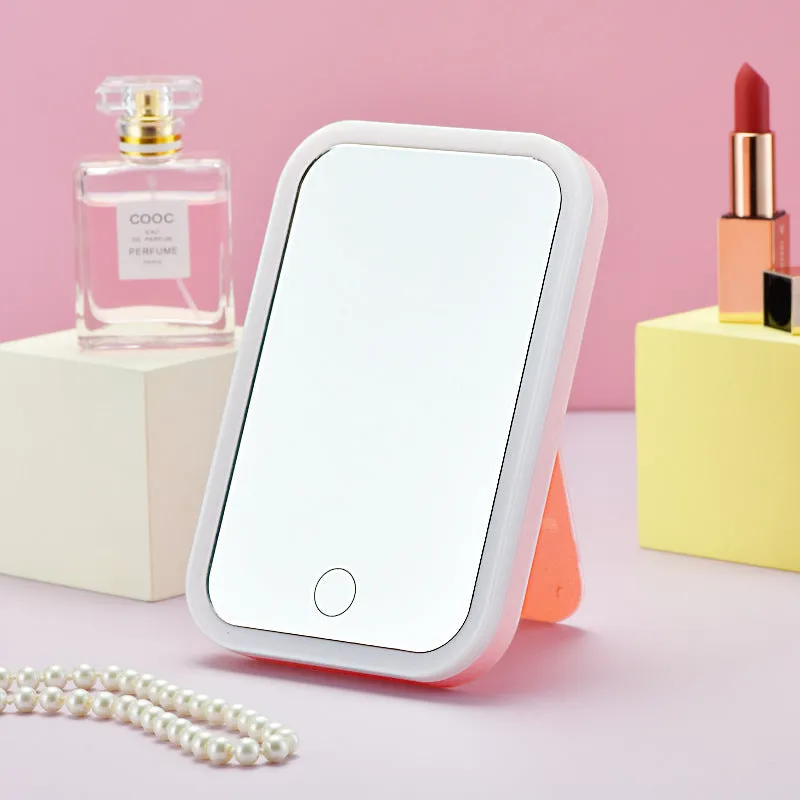 Square LED makeup mirror with smart touch light in pink colour, plastic frame, silver mirror lens