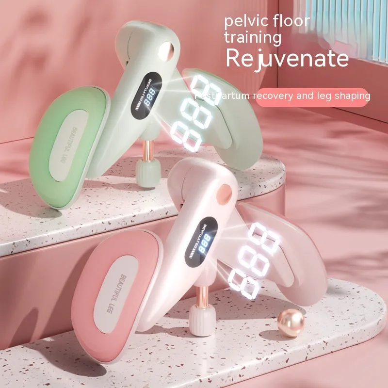 Grey coloured pelvic floor muscle trainer with a counter display, held in hand.