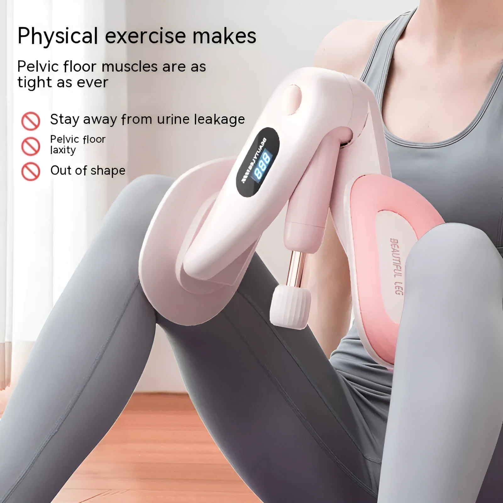 Grey coloured pelvic floor muscle trainer with a counter display, held in hand.