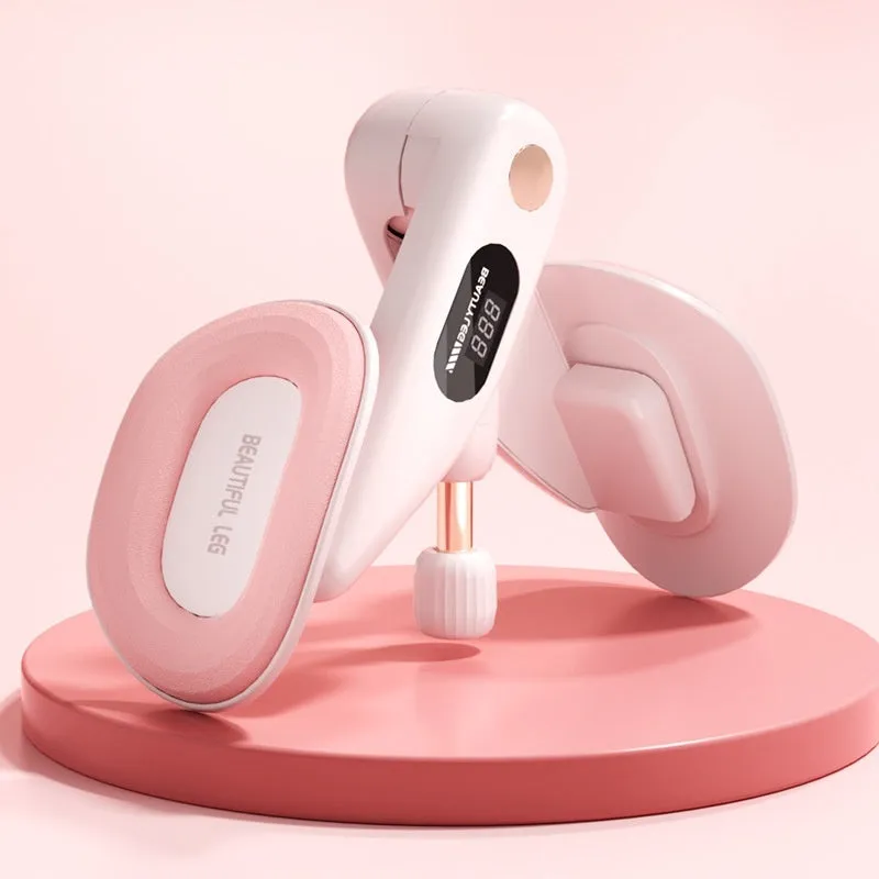 Grey coloured pelvic floor muscle trainer with a counter display, held in hand.