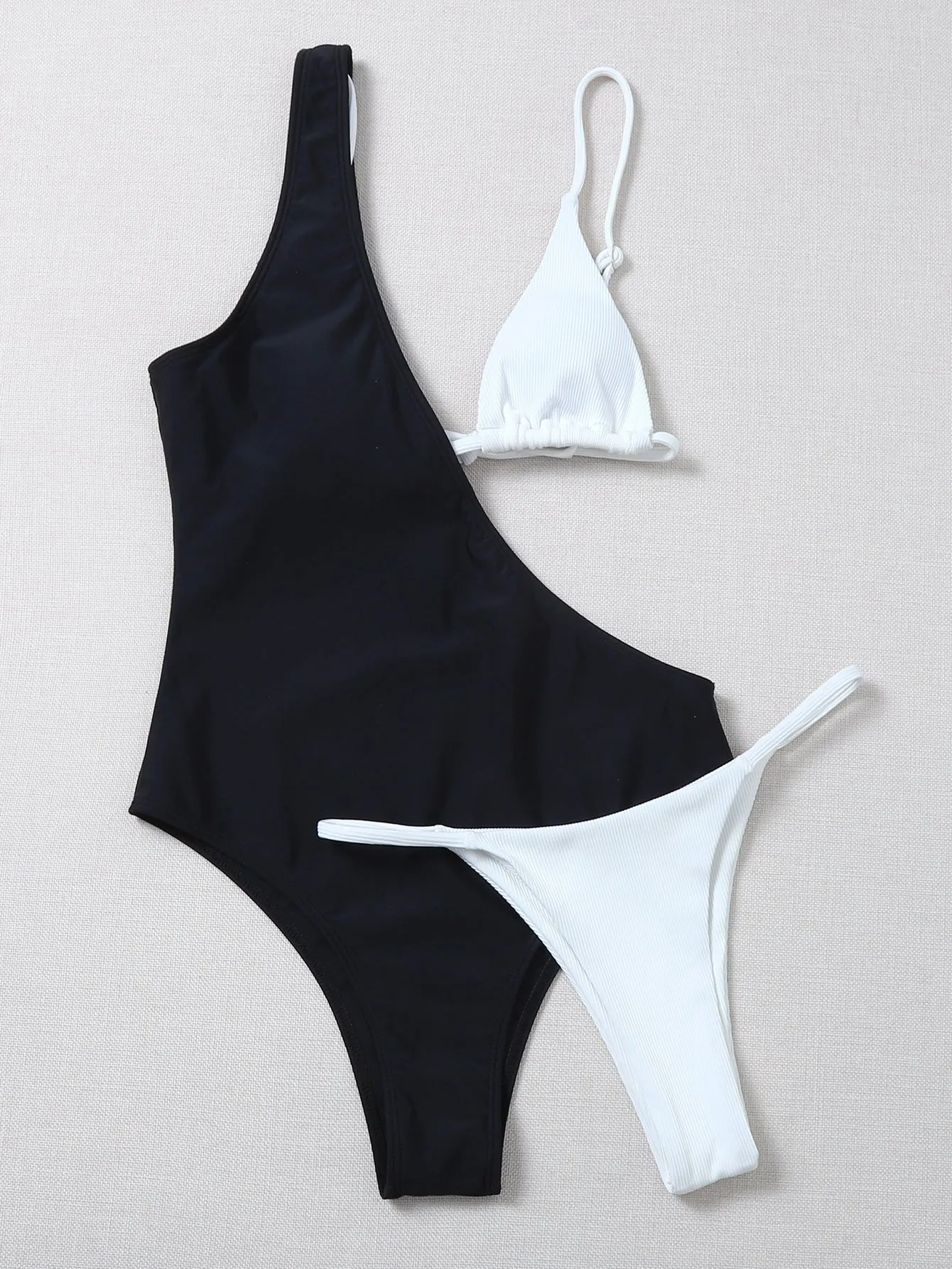 Solid colour bikini with chest pad in black and white, polyester fabric, front view