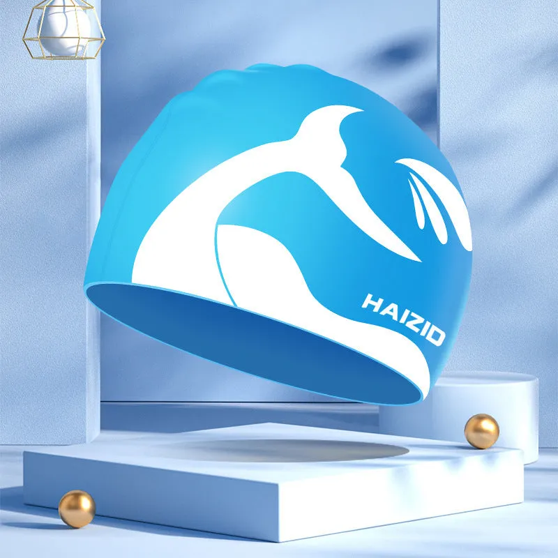 Silicone swimming cap with waterproof ear protectors showing whale tail pattern in assorted colours