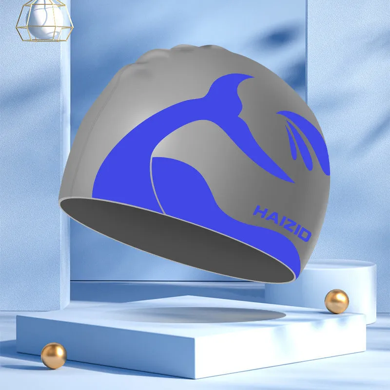 Silicone swimming cap with waterproof ear protectors showing whale tail pattern in assorted colours