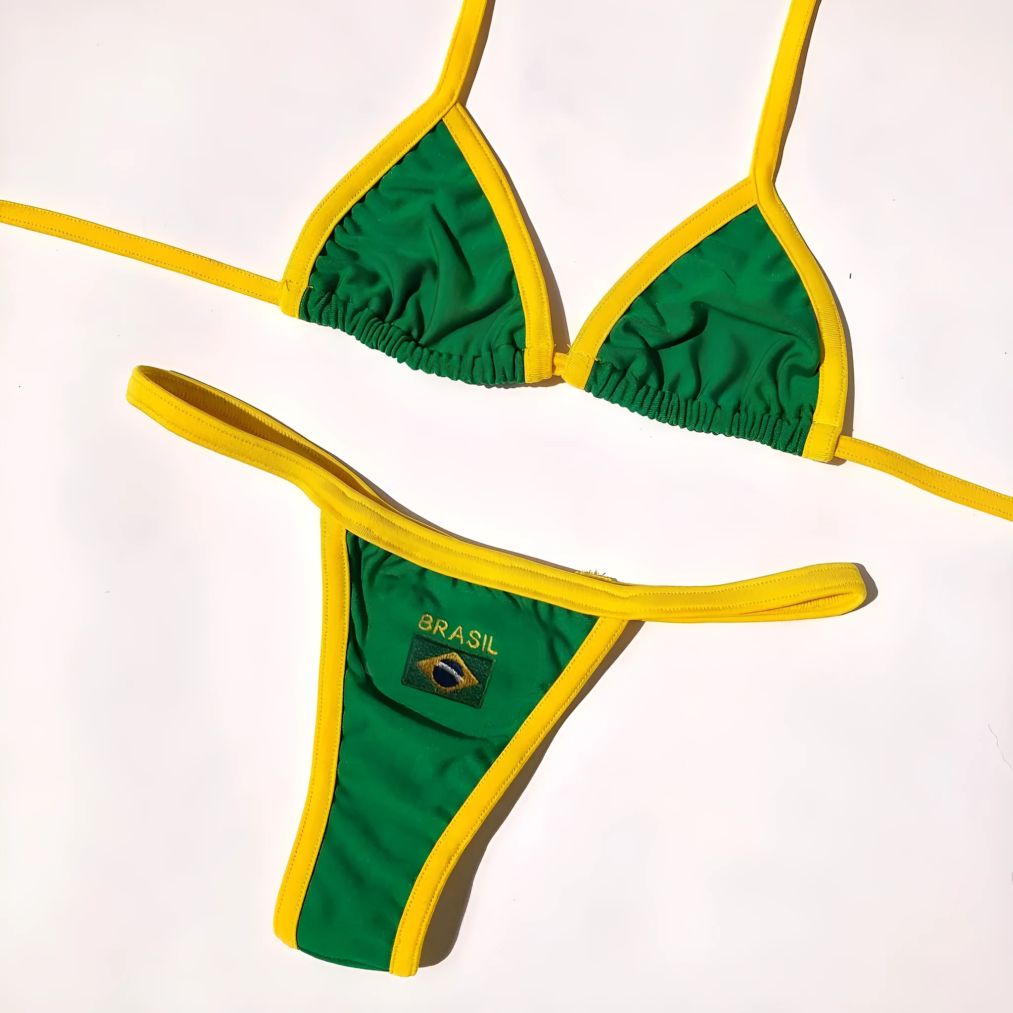 Women's yellow polyester bikini set showing T-back bra top and short-length bottoms on a mannequin.