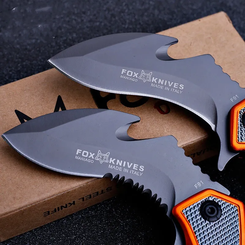 Orange folding knife with steel handle and 8.2cm blade open on outdoor surface showing total length and grip texture