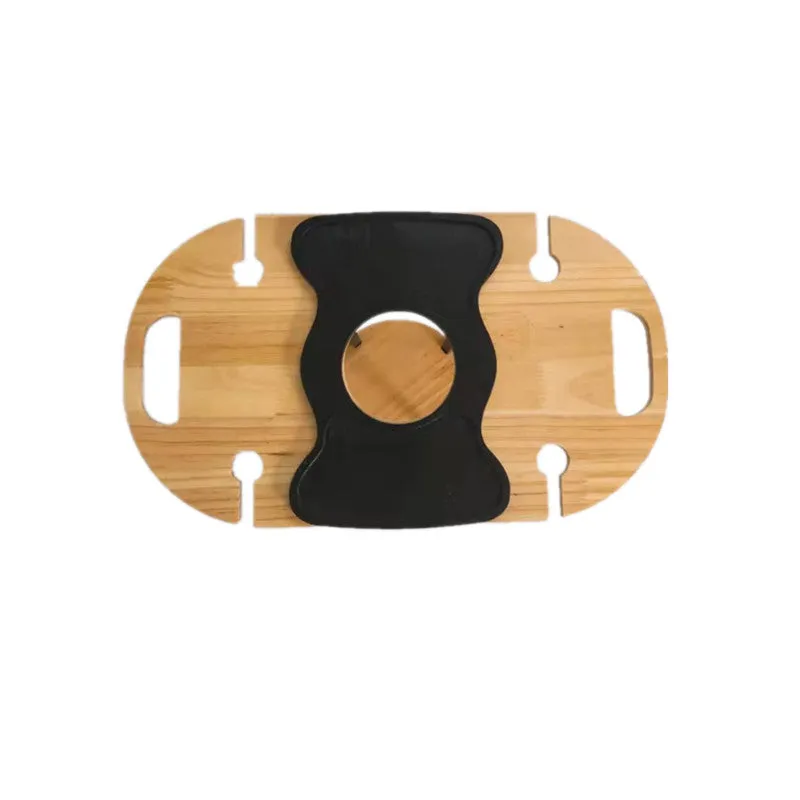 Creative multifunctional white wood wine glass rack tray with bottle holder handle holding four wine glasses and a bottle on a picnic table