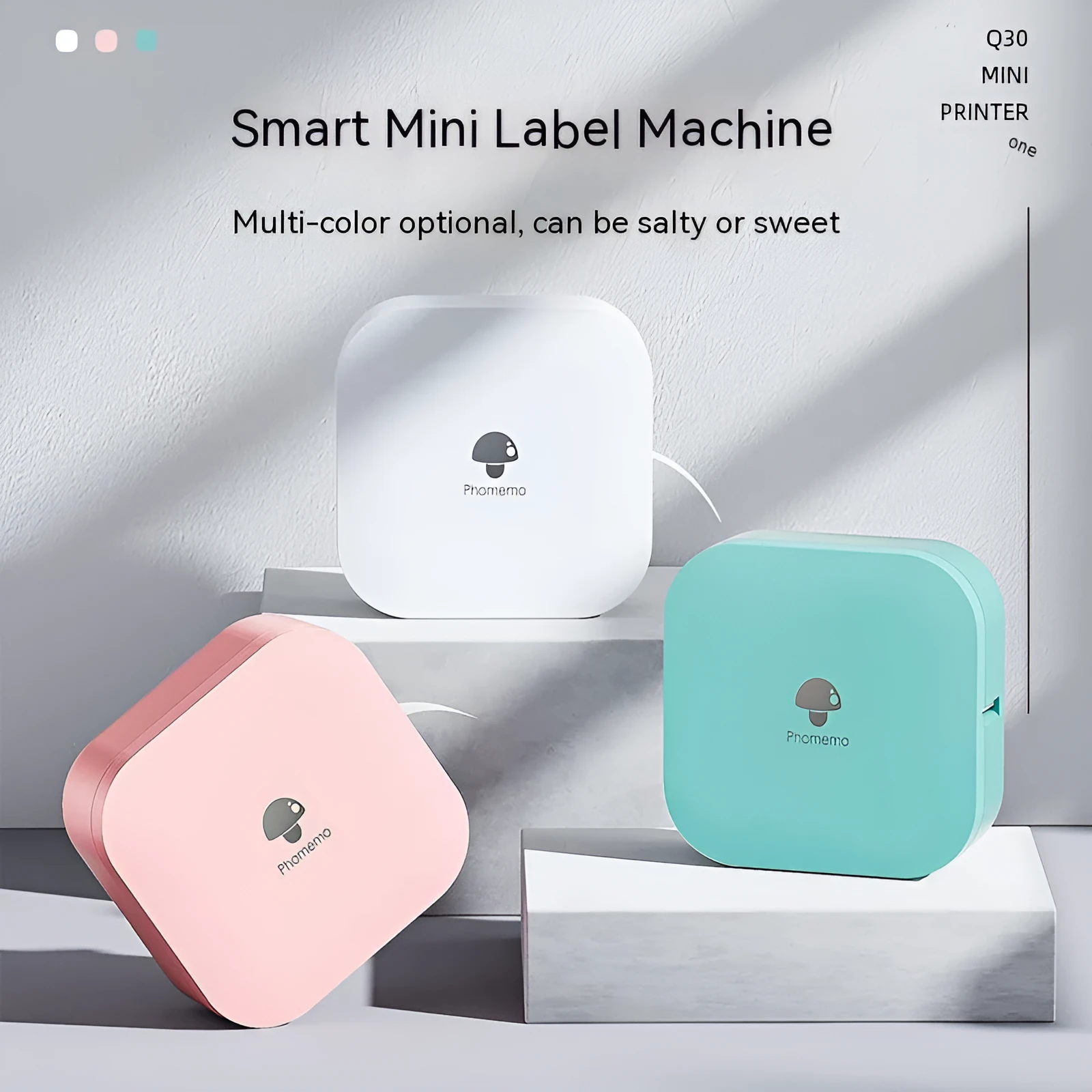 Q30 thermal mini label printer in green, compact size 82x82x32mm, with self-adhesive paper roll on white background