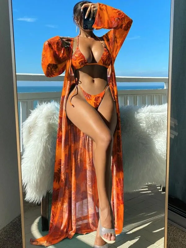 Blue long sleeve bikini set with banded briefs and a matching outer robe laid flat
