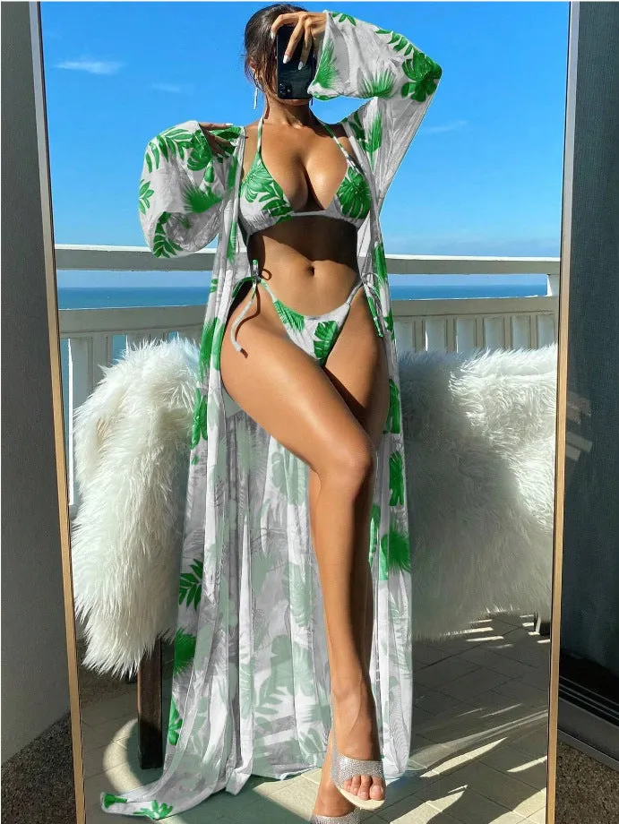Blue long sleeve bikini set with banded briefs and a matching outer robe laid flat