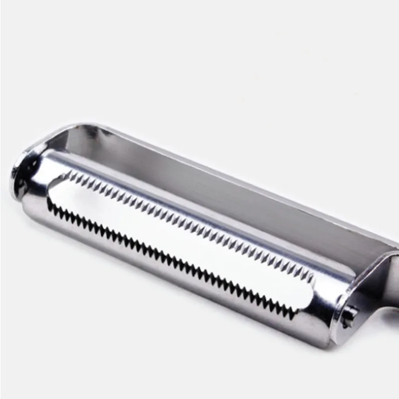 Silver stainless steel fruit and vegetable peeler on a clean kitchen counter