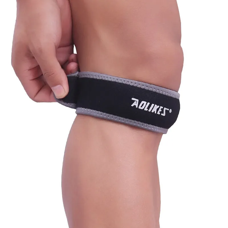 Black and grey patella retinaculum knee support for sports protection.