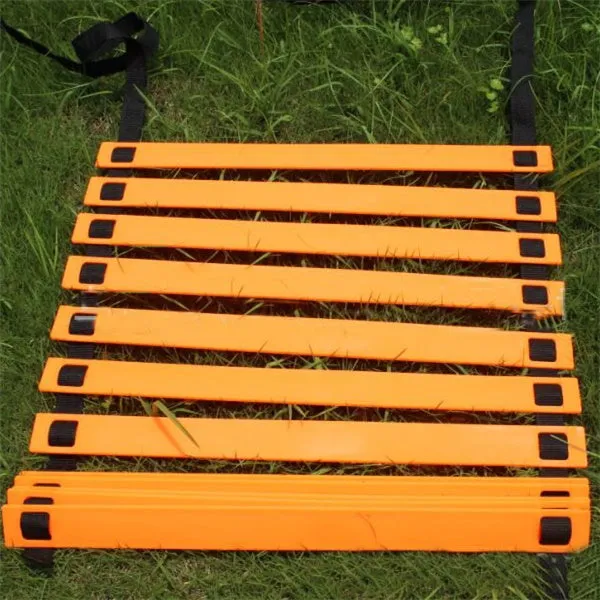 PP jump ladder in black laid flat on grass for foot basket training