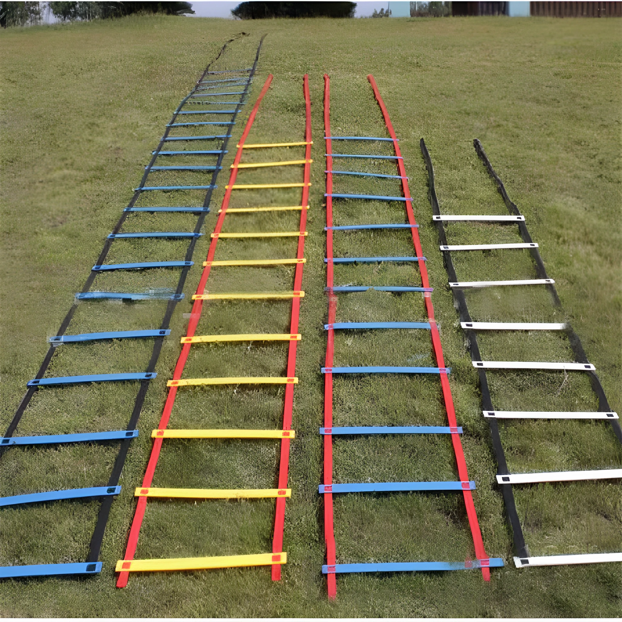 PP jump ladder in black laid flat on grass for foot basket training