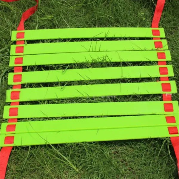 PP jump ladder in black laid flat on grass for foot basket training