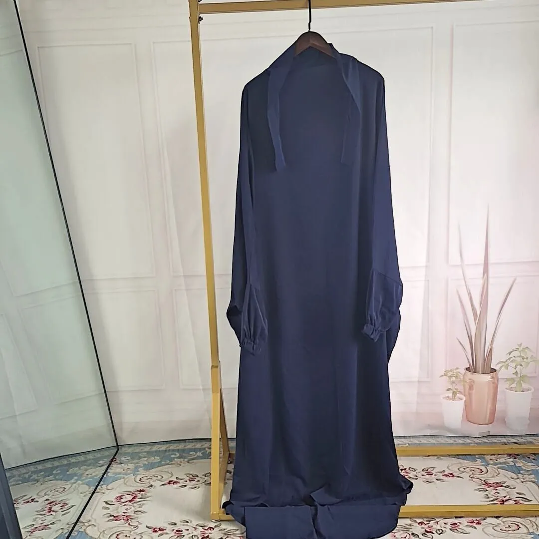 Women's one-piece prayer dress in dark green polyester with regular sleeves and strap details