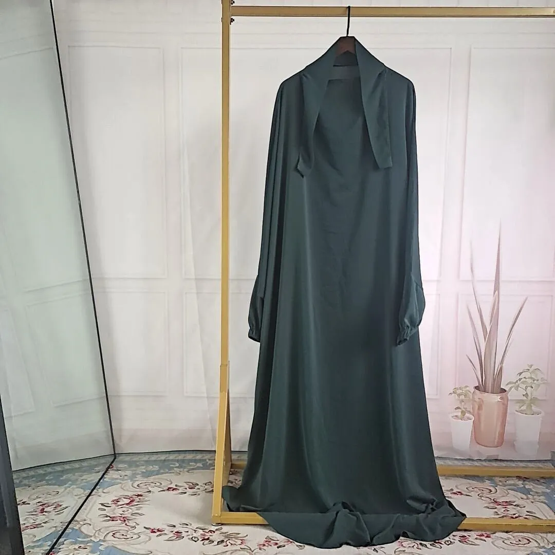 Women's one-piece prayer dress in dark green polyester with regular sleeves and strap details
