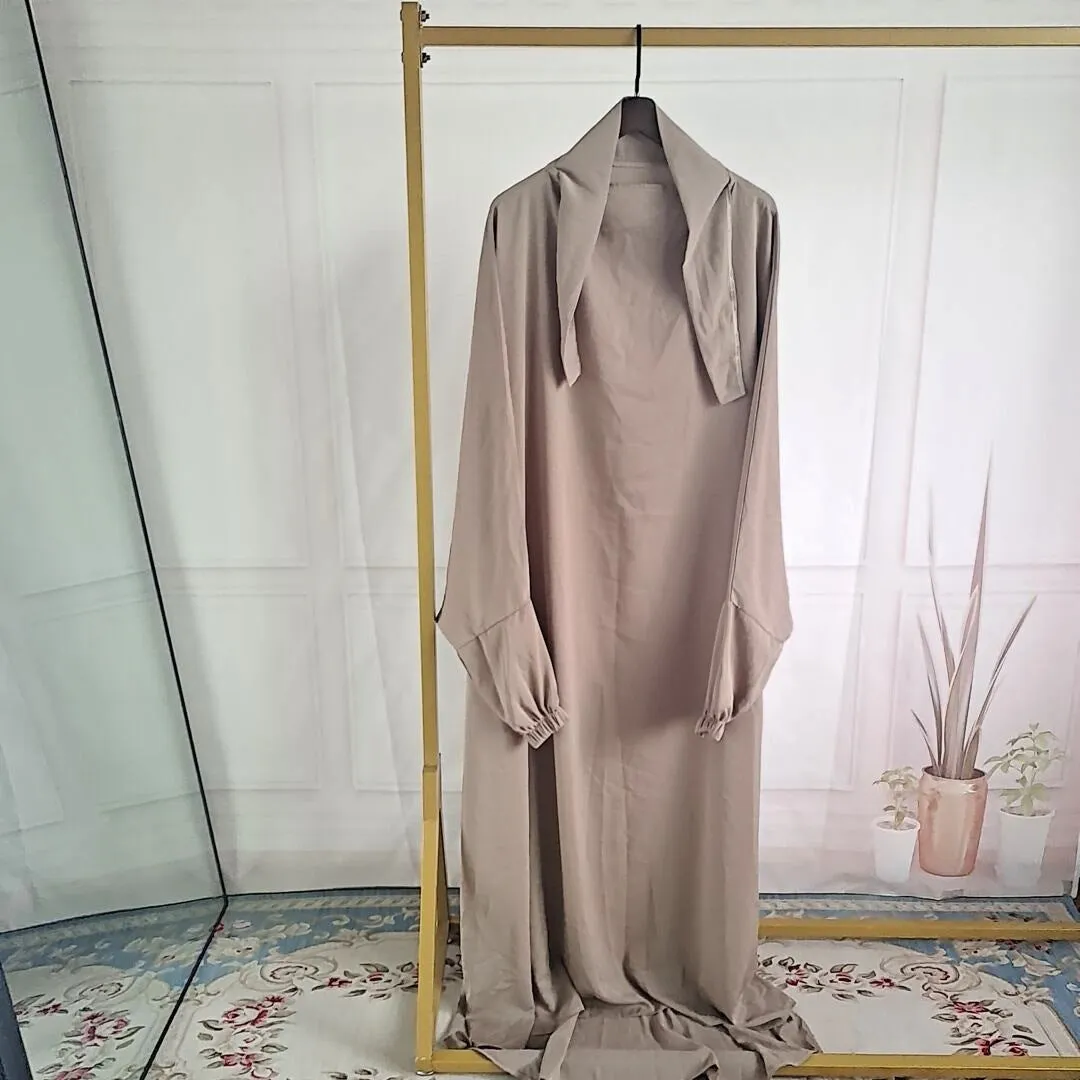 Women's one-piece prayer dress in dark green polyester with regular sleeves and strap details