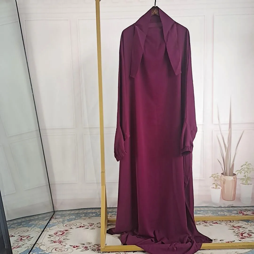 Women's one-piece prayer dress in dark green polyester with regular sleeves and strap details