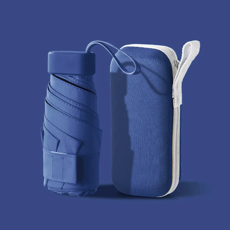 Ultra-light six-fold flat capsule sun protection umbrella in sky blue with manual open mode and rubber handle.