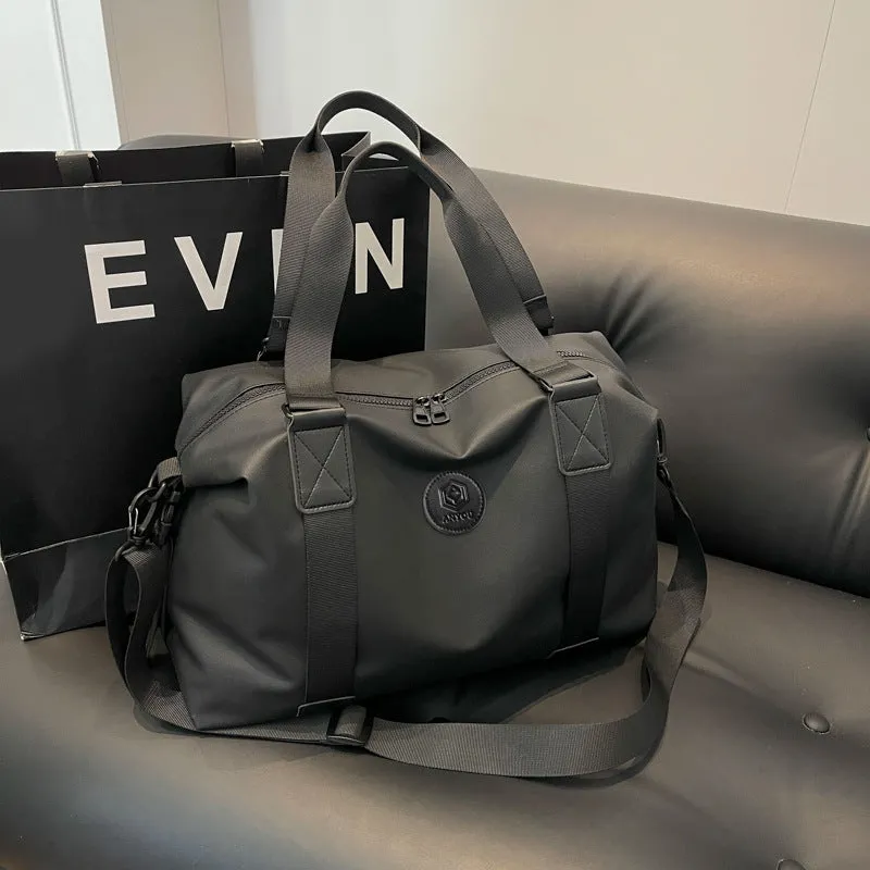 Large black waterproof Oxford cloth travel rucksack with multiple compartments shown on a grey background.