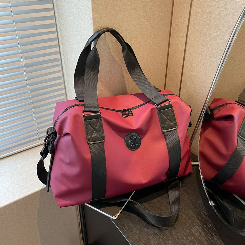 Large black waterproof Oxford cloth travel rucksack with multiple compartments shown on a grey background.