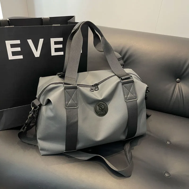 Large black waterproof Oxford cloth travel rucksack with multiple compartments shown on a grey background.