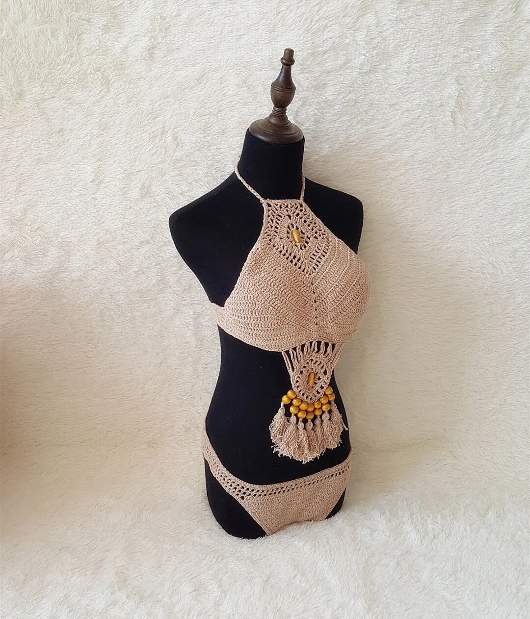 Crochet tassel bikini set for women in black, showing textured weave and tassel trim, beach style