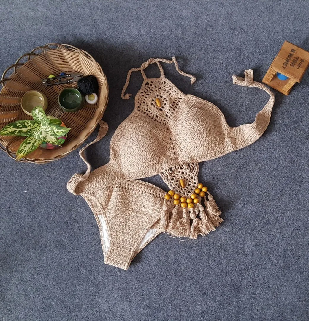 Crochet tassel bikini set for women in black, showing textured weave and tassel trim, beach style