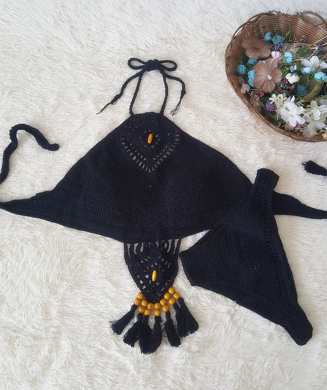 Crochet tassel bikini set for women in black, showing textured weave and tassel trim, beach style