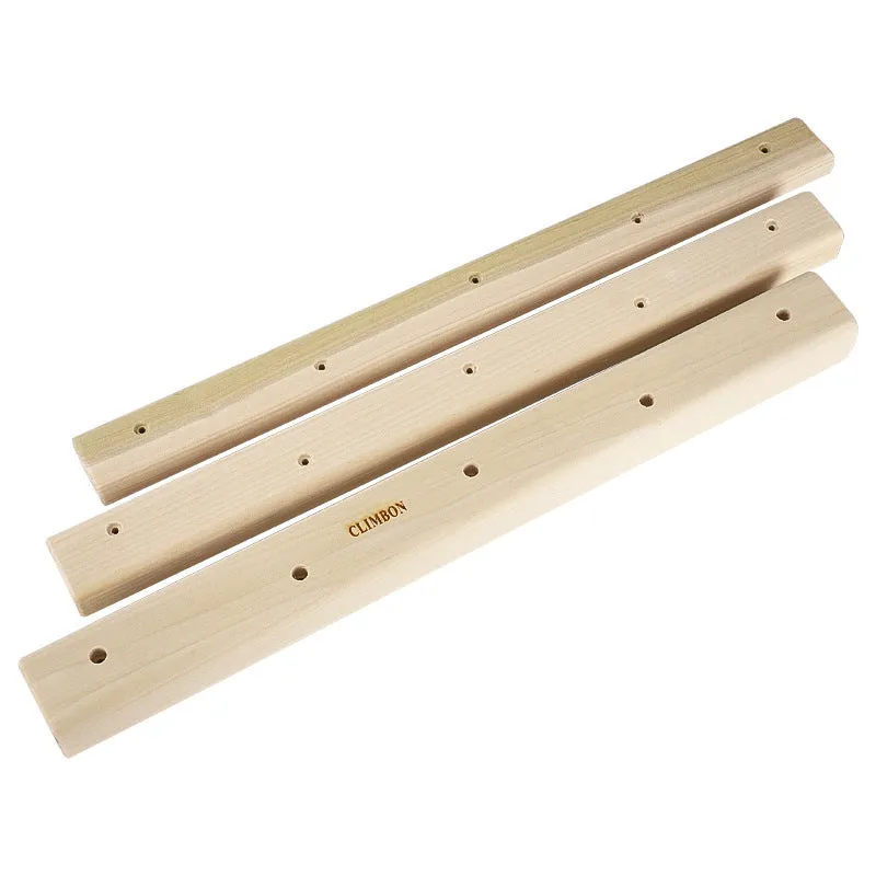 Set of three solid wooden grip strength training hangboards in different sizes on a grey background.