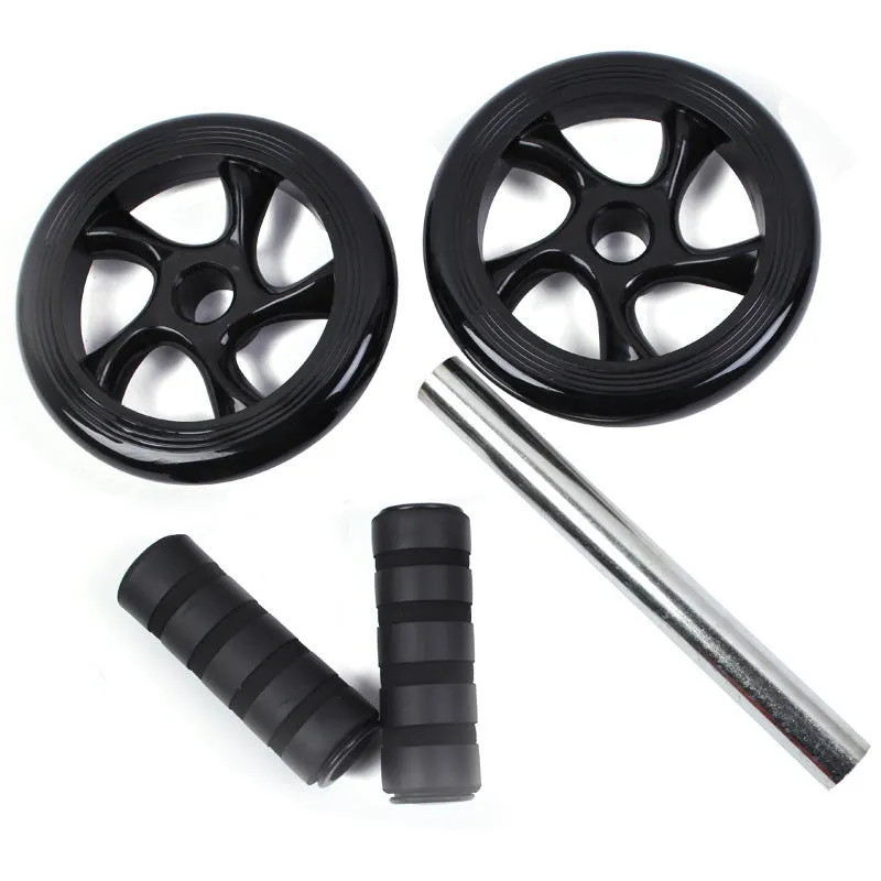 Silent abdominal wheel with kneeling pad, black colour, 165mm diameter, on a gym mat