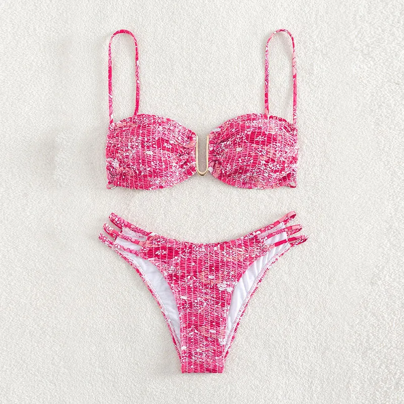 Women's floral bikini swimsuit with high-waist briefs in solid colour patterns
