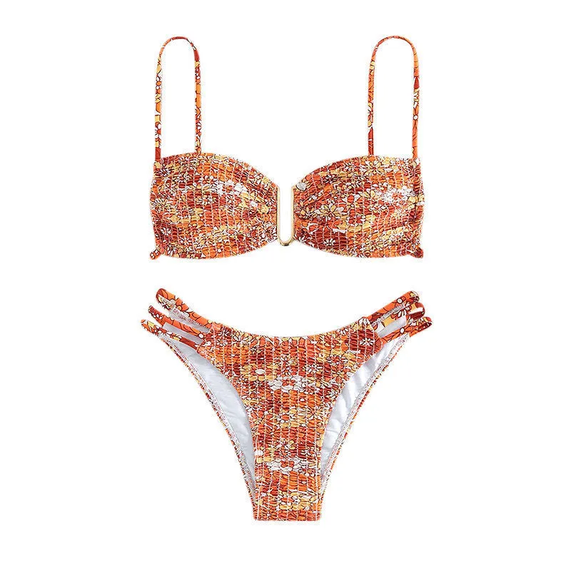 Women's floral bikini swimsuit with high-waist briefs in solid colour patterns