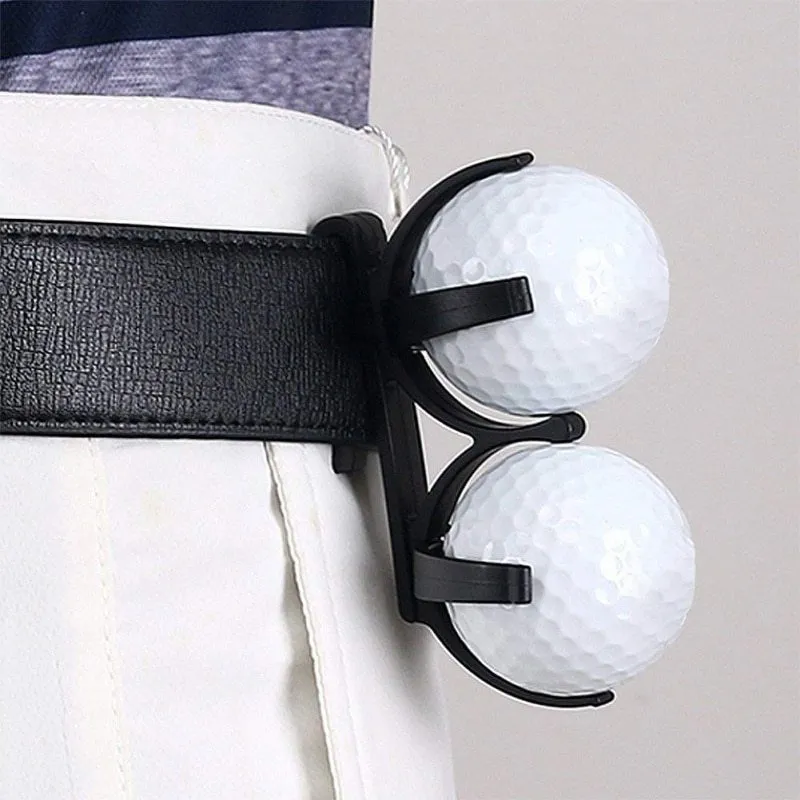 Black plastic golf ball holder clip for belt or bag, holds two golf balls, approx 8 x 4.2 x 1cm