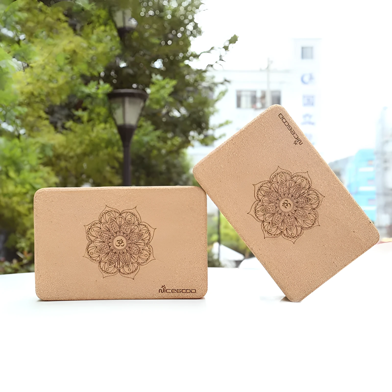 High-density natural cork yoga brick with rounded edges on a wooden floor