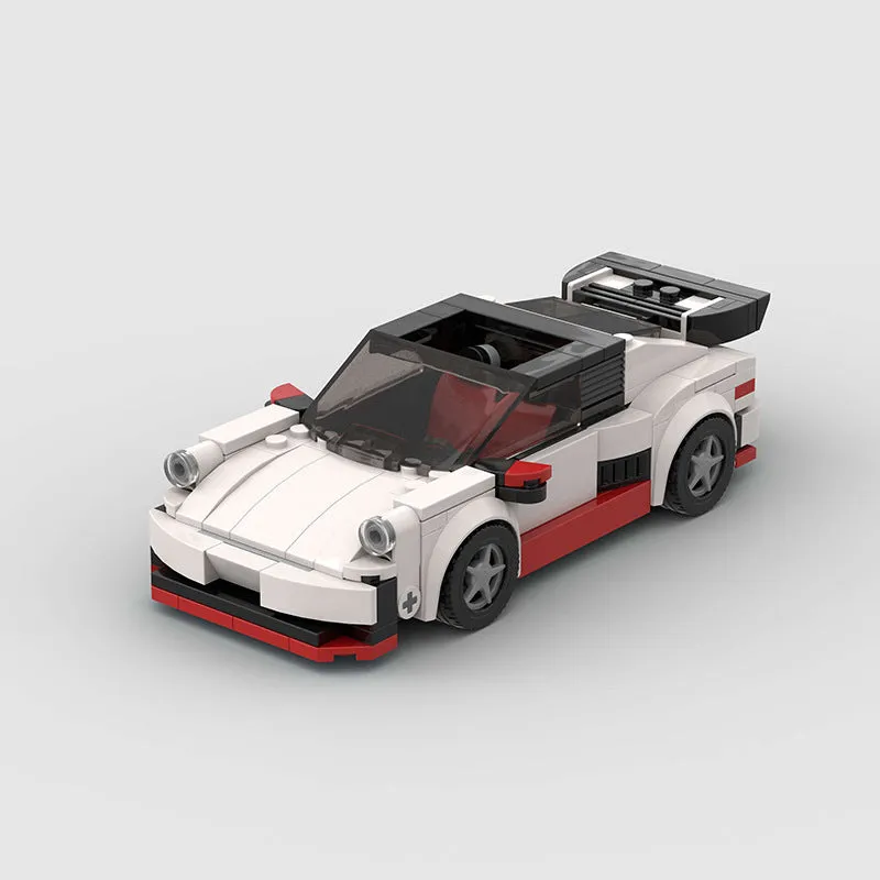 Small particle plastic building blocks model of a cool convertible sports car on a table