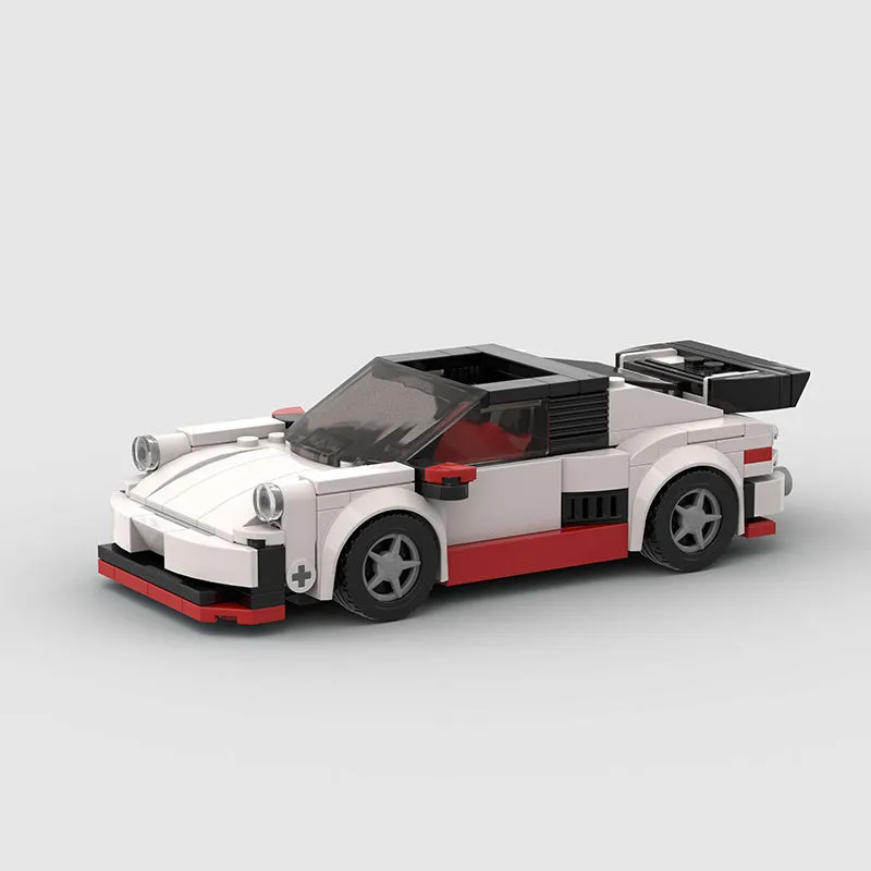 Small particle plastic building blocks model of a cool convertible sports car on a table