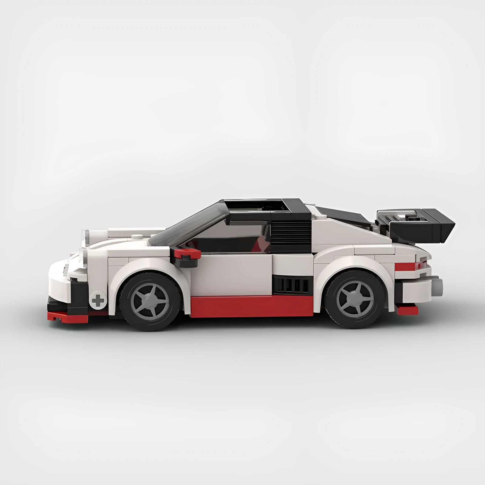 Small particle plastic building blocks model of a cool convertible sports car on a table