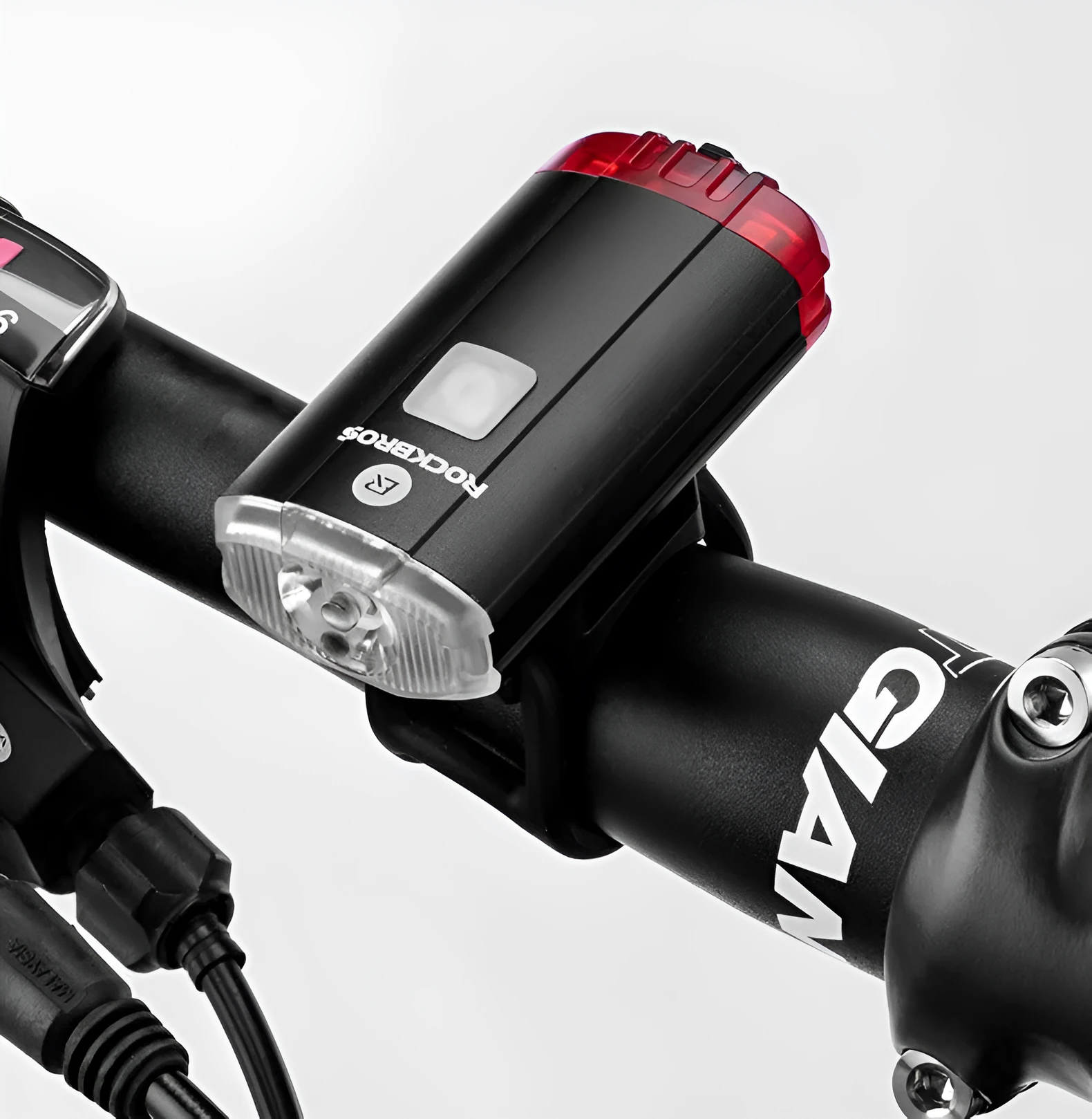 Black bicycle helmet light with aluminium alloy shell showing USB charging port and compact 6.3cm size
