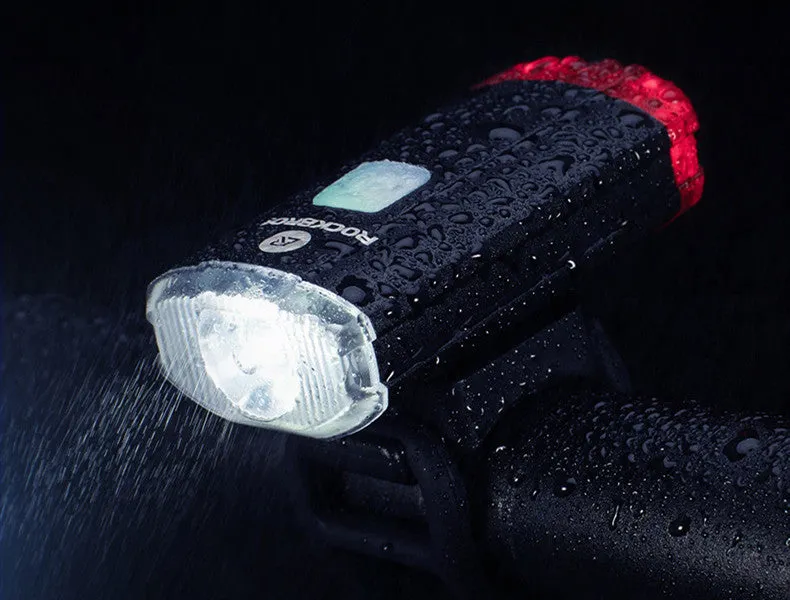 Black bicycle helmet light with aluminium alloy shell showing USB charging port and compact 6.3cm size